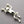 Load image into Gallery viewer, Silver frog brooch on a gray background