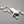 Load image into Gallery viewer, Silver frog brooch on a dark gray background
