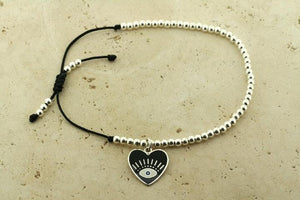 Enamelled black flying heart bead bracelet - Makers & Providers