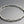 Load image into Gallery viewer, Silver bracelet with wavy design on a gray background