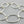 Load image into Gallery viewer, Silver bracelet with interlocking rings on a gray background
