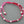Load image into Gallery viewer, Pink macrame bracelet with silver beads on a gray background