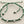Load image into Gallery viewer, Green macrame bracelet with silver beads on a gray background