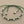 Load image into Gallery viewer, Green beaded necklace on a gray background