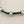 Load image into Gallery viewer, Green macrame bracelet with silver beads on a gray background