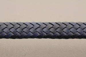 Close-up of a blue braided leather bracelet on a gray background