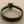 Load image into Gallery viewer, Green braided bracelet on a gray background