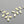 Load image into Gallery viewer, Curved 6 leaf earring - brass & silver