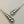 Load image into Gallery viewer, Silver earrings with geometric design on a gray background