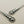 Load image into Gallery viewer, Silver earrings with decorative design on a gray background