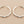 Load image into Gallery viewer, Pair of silver hoop earrings on a gray background