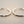 Load image into Gallery viewer, Pair of silver hoop earrings on a gray background