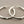 Load image into Gallery viewer, Silver hoop earrings on a gray background