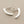 Load image into Gallery viewer, Silver curved earrings on a gray background