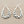 Load image into Gallery viewer, Pair of silver hoop earrings on a gray background