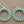 Load image into Gallery viewer, Pair of hoop earrings with turquoise beads on a gray background