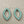 Load image into Gallery viewer, Pair of earrings with turquoise stones on a gray background