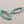 Load image into Gallery viewer, Teardrop-shaped earrings with turquoise stones on a gray background