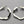 Load image into Gallery viewer, Pair of silver hoop earrings on a gray background