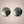 Load image into Gallery viewer, Pair of silver round earrings on a gray background