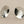 Load image into Gallery viewer, Pair of silver round earrings on a gray background