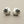 Load image into Gallery viewer, Pair of silver earrings on a gray background