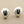 Load image into Gallery viewer, Pair of silver shell-shaped earrings on a gray background