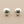 Load image into Gallery viewer, Pair of silver shell-shaped earrings on a gray background