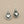 Load image into Gallery viewer, Silver heart-shaped earrings on a gray background