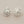 Load image into Gallery viewer, Silver sunflower-shaped earrings on a gray background