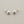 Load image into Gallery viewer, Pair of silver ball earrings on a gray background