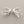 Load image into Gallery viewer, Silver branch-like earrings on a dark gray background