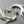 Load image into Gallery viewer, Silver twig-like earrings on a dark gray background