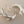 Load image into Gallery viewer, Silver twig-like earrings on a dark gray background