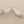 Load image into Gallery viewer, Silver leaf-shaped earrings on a dark gray background