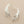 Load image into Gallery viewer, Silver leaf-shaped earrings on a gray background