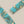 Load image into Gallery viewer, Turquoise and gold bar-shaped earrings on a gray background
