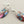 Load image into Gallery viewer, Multicolored stone earrings on a gray background