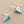 Load image into Gallery viewer, Turquoise triangle earrings on a gray background