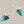 Load image into Gallery viewer, Turquoise triangle earrings with silver hooks on a gray background