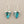 Load image into Gallery viewer, Turquoise triangle earrings with silver hooks on a gray background