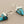 Load image into Gallery viewer, Turquoise triangle earrings with silver hooks on a gray background