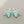 Load image into Gallery viewer, Turquoise triangle earrings with silver hooks on a gray background
