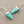 Load image into Gallery viewer, Turquoise cone-shaped earrings with silver hooks on a gray background