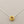 Load image into Gallery viewer, Gold pendant on a silver chain against a gray background