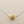 Load image into Gallery viewer, Gold necklace pendant on a silver chain against a gray background