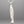 Load image into Gallery viewer, Silver fish-shaped pendant on a chain against a gray background