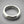 Load image into Gallery viewer, Silver ring on a gray background