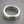 Load image into Gallery viewer, Silver ring with a textured surface on a gray background