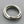 Load image into Gallery viewer, Silver ring with three interlocking bands on a gray background